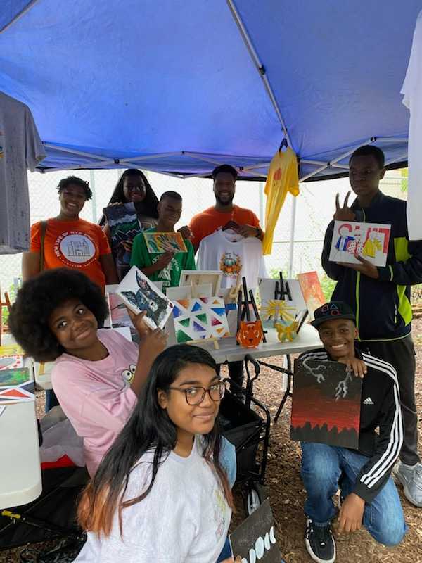 New Lifers showing off their artwork in an exhibit